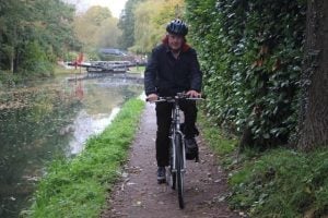 Lucas Schoemaker Stroud Trinity Town councillor, using the canal cycle path.