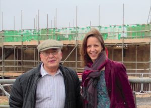 Councillors Norman Kay and Catherine Braun next to a building site.