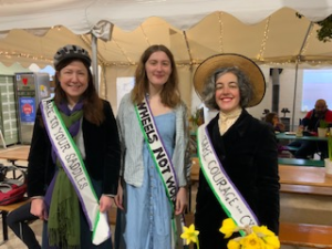 Pippa, centre, with Chloe Turner and Beki Aldam, all dressed as suffragettes for the bike ride